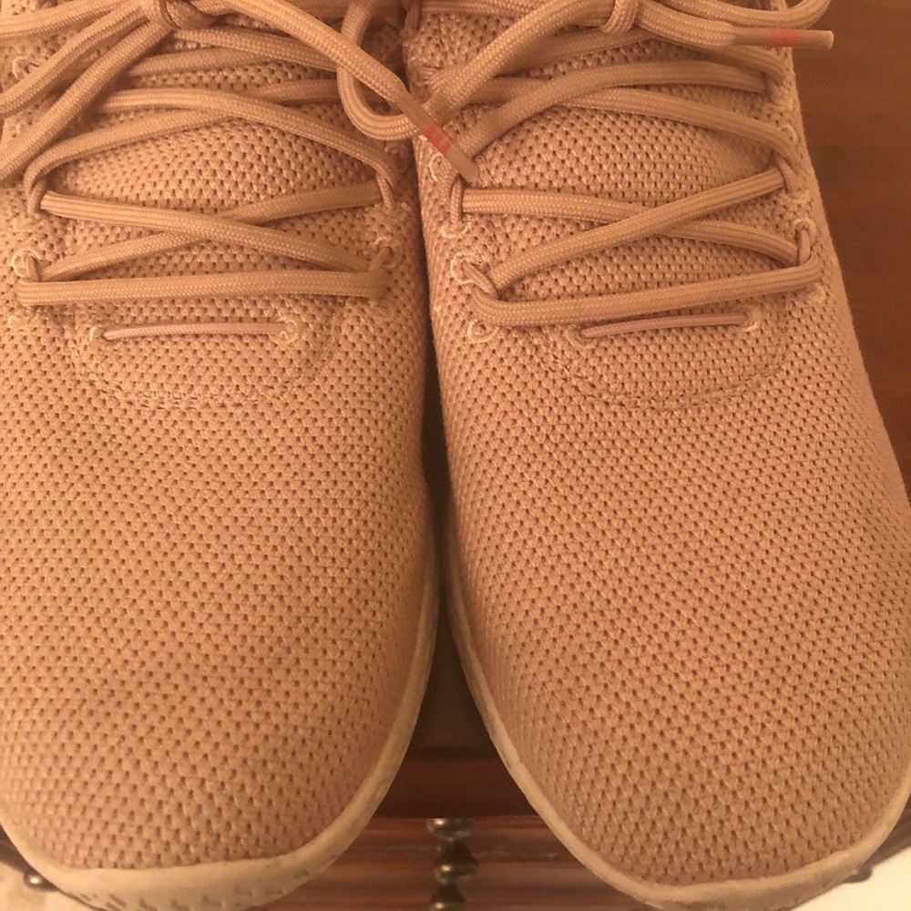 Adidas Pharrell Williams in light tan/pinkish hue.